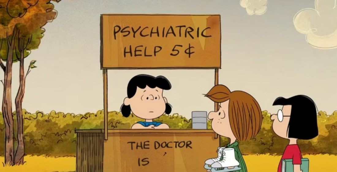 Lucy, de la serie Peanuts vende consejos psiquiátricos por 5 centavos en un stand de madera en el parque.